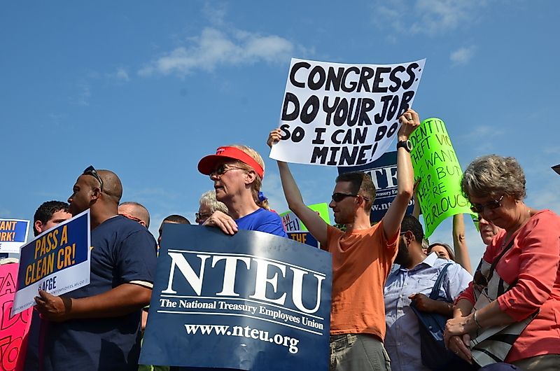 Federal employees protest the government shutdown at a rally outside of the Capitol