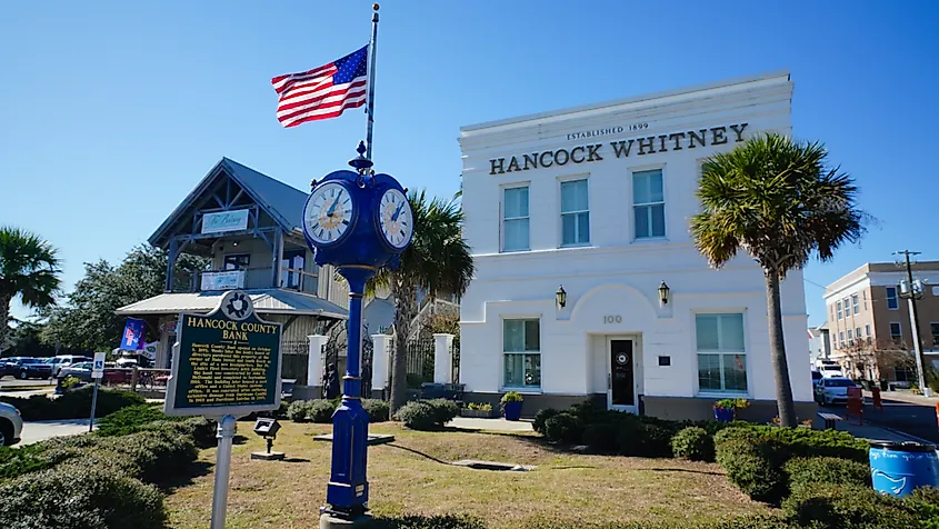 Historic bank building and clock along Main Street in Bay St. Louis, Mississippi