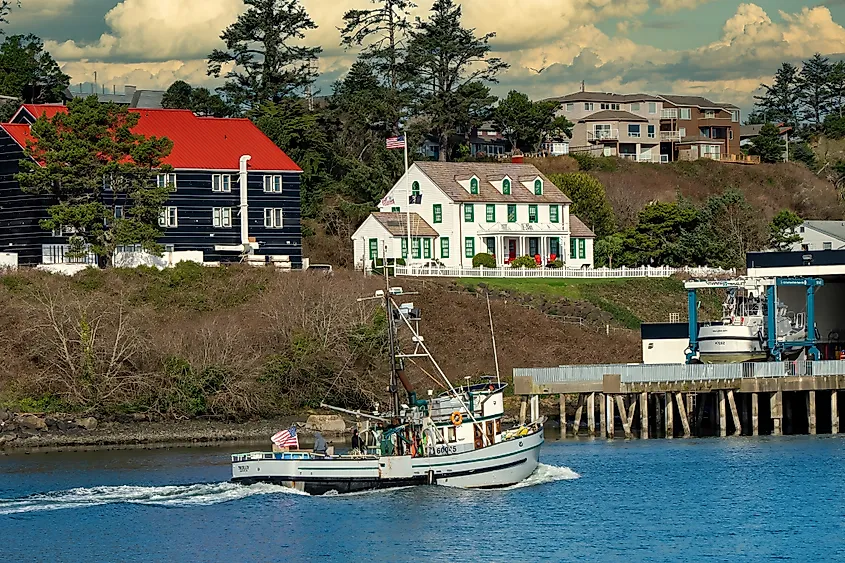 Fishing boat returning to shore in Newport, Oregon.